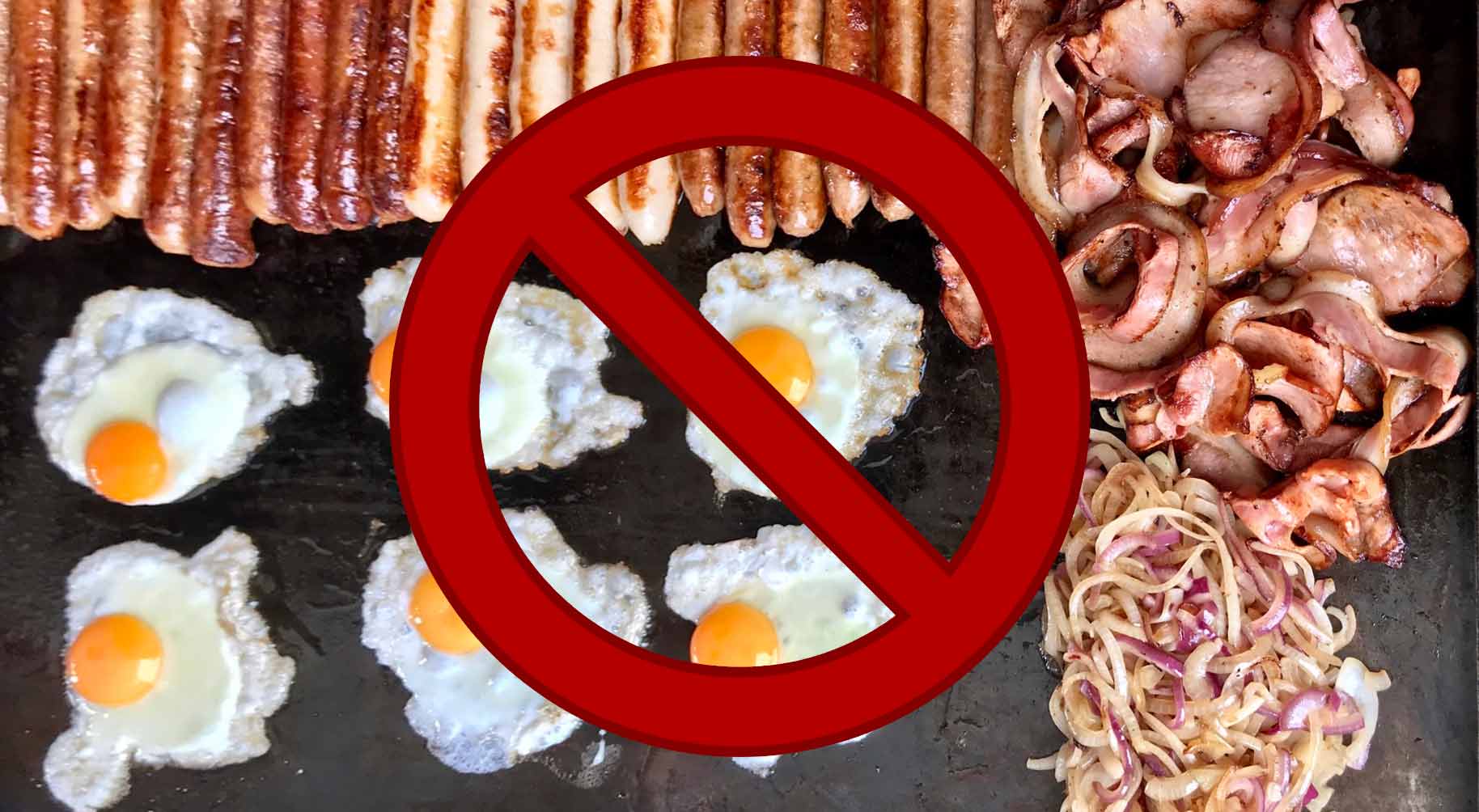 Breakfast of sausage, bacon, and fried eggs - with prohibition sign overlay