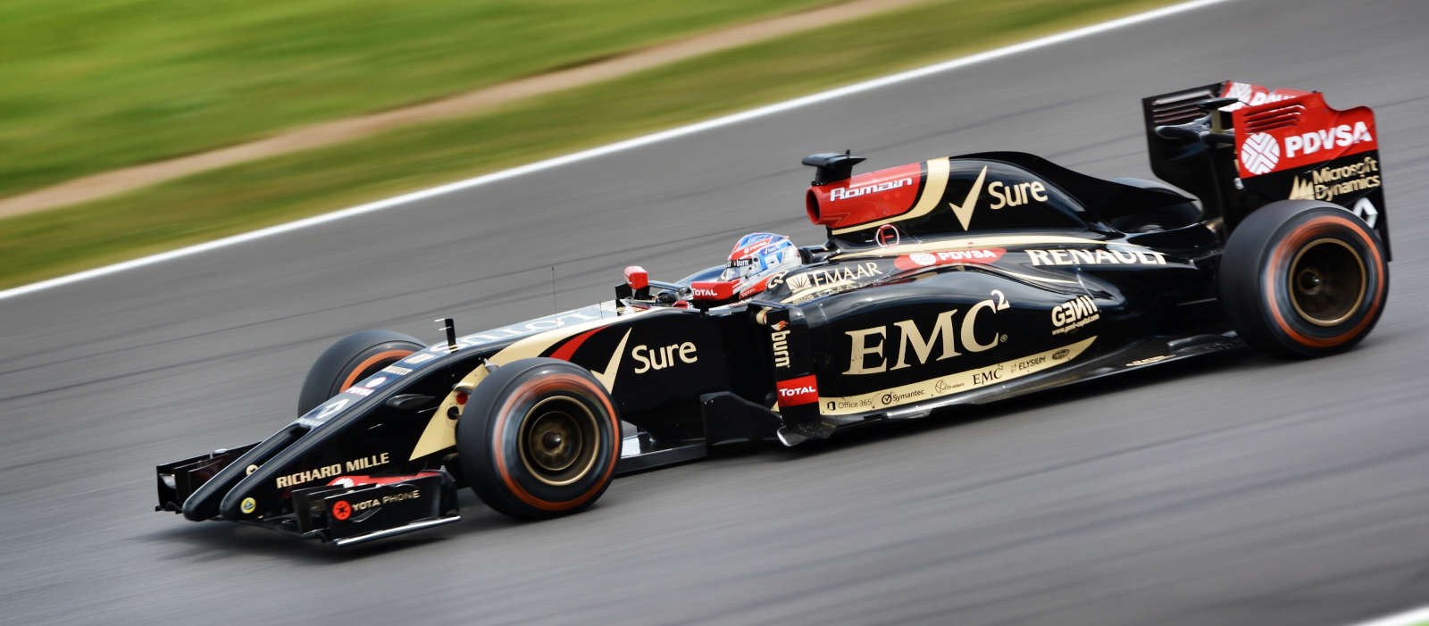 close-up of a formula 1 car racing fast on a racetrack