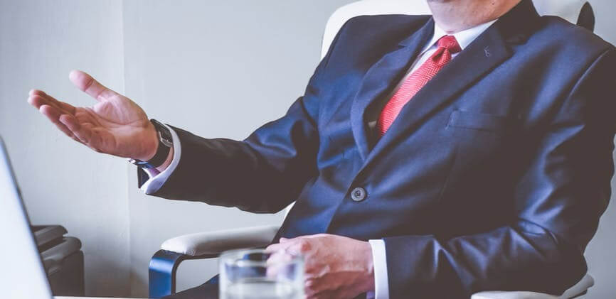 Man in suit at office desk