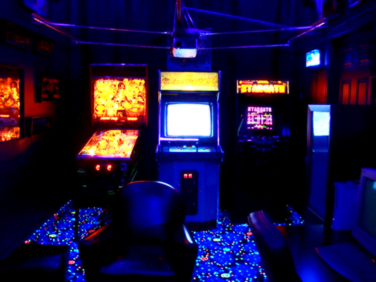 Back room of an arcade, with a few arcade cabinets